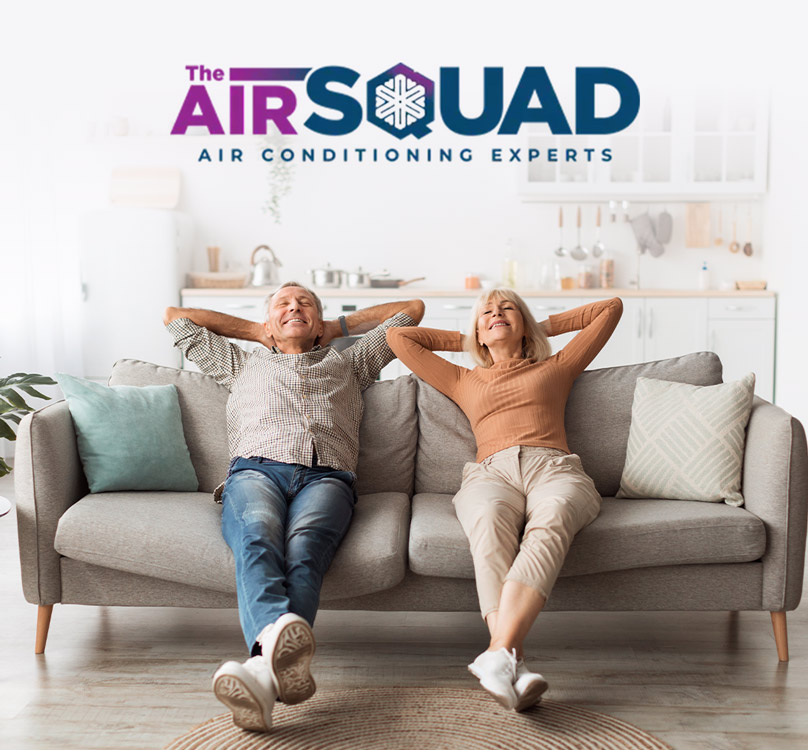 Couple relaxing on a couch together under The Air Squad logo